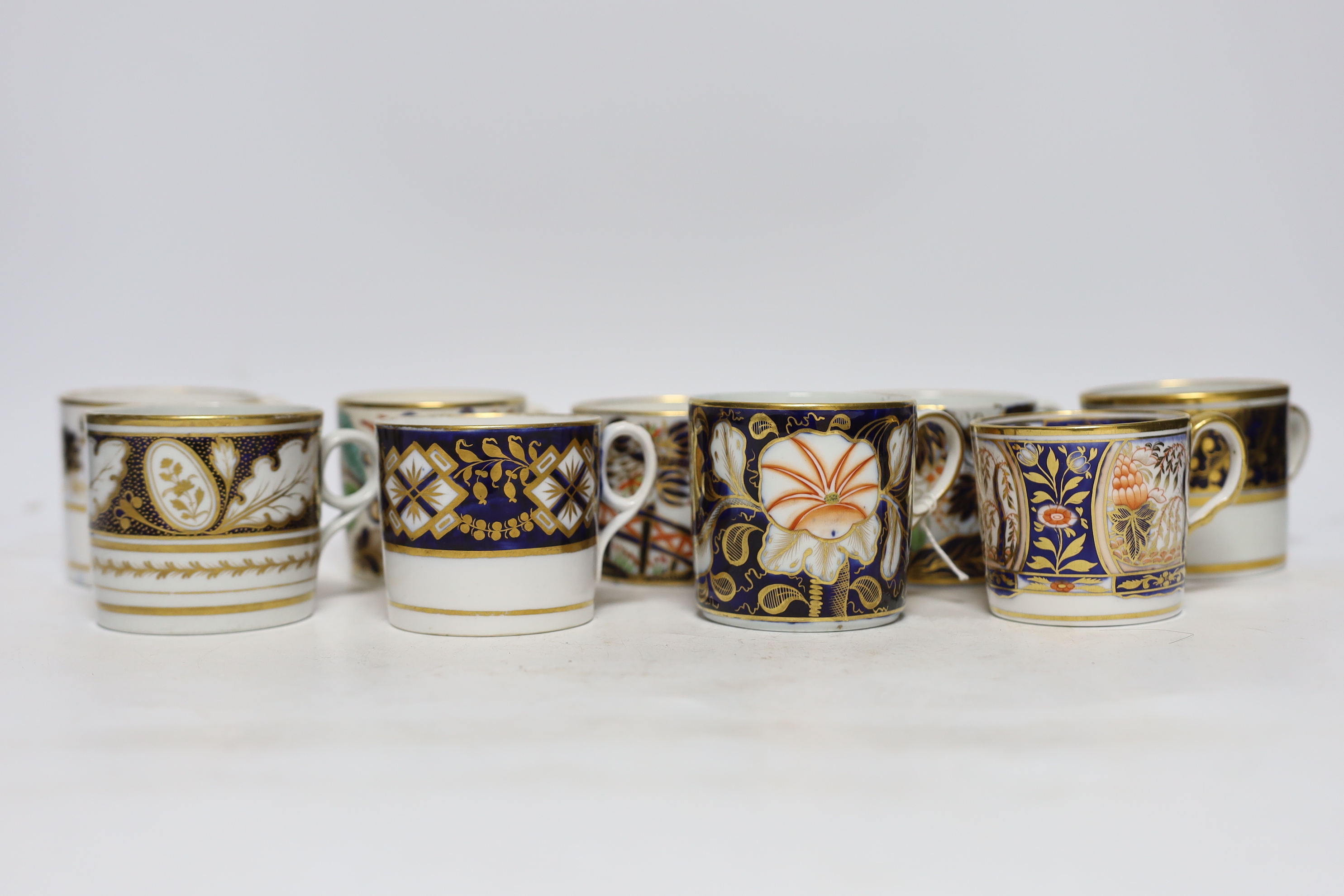 Twelve 1800-1820 English porcelain coffee cans, including Imari pattern examples